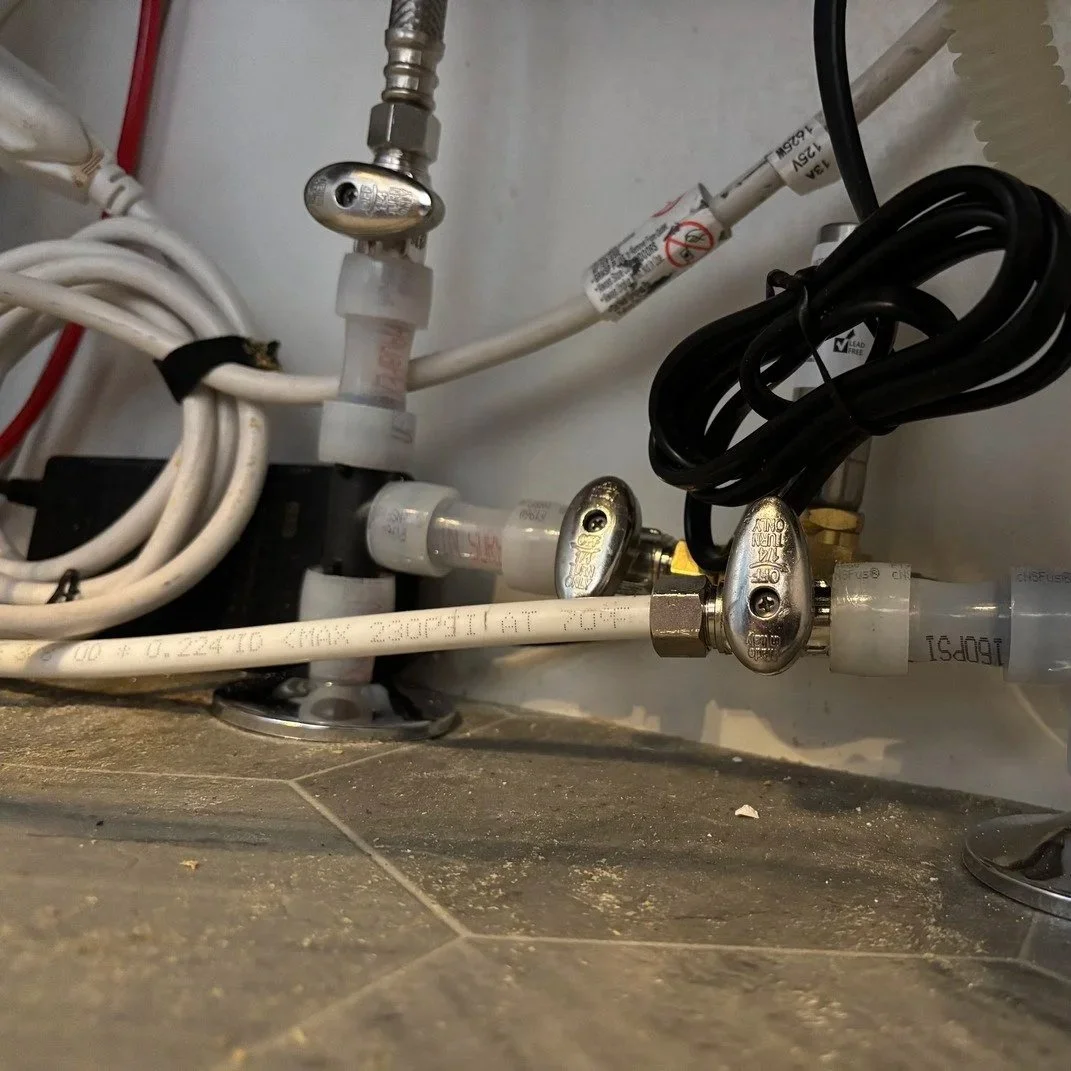 PEX repiping installation replacing old corroded pipes in a Hillsboro home, preventing leaks and long-term water damage.