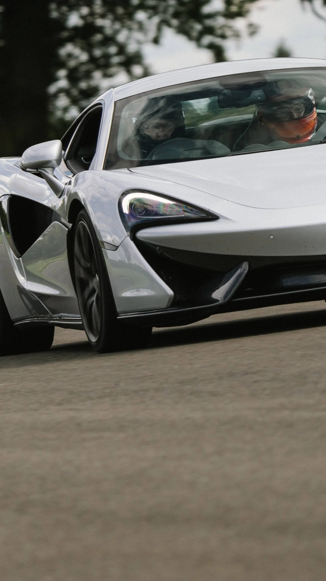 A Silver McLaren 570S on track at Curborough Sprint Course in Lichfield, during a driving experience.