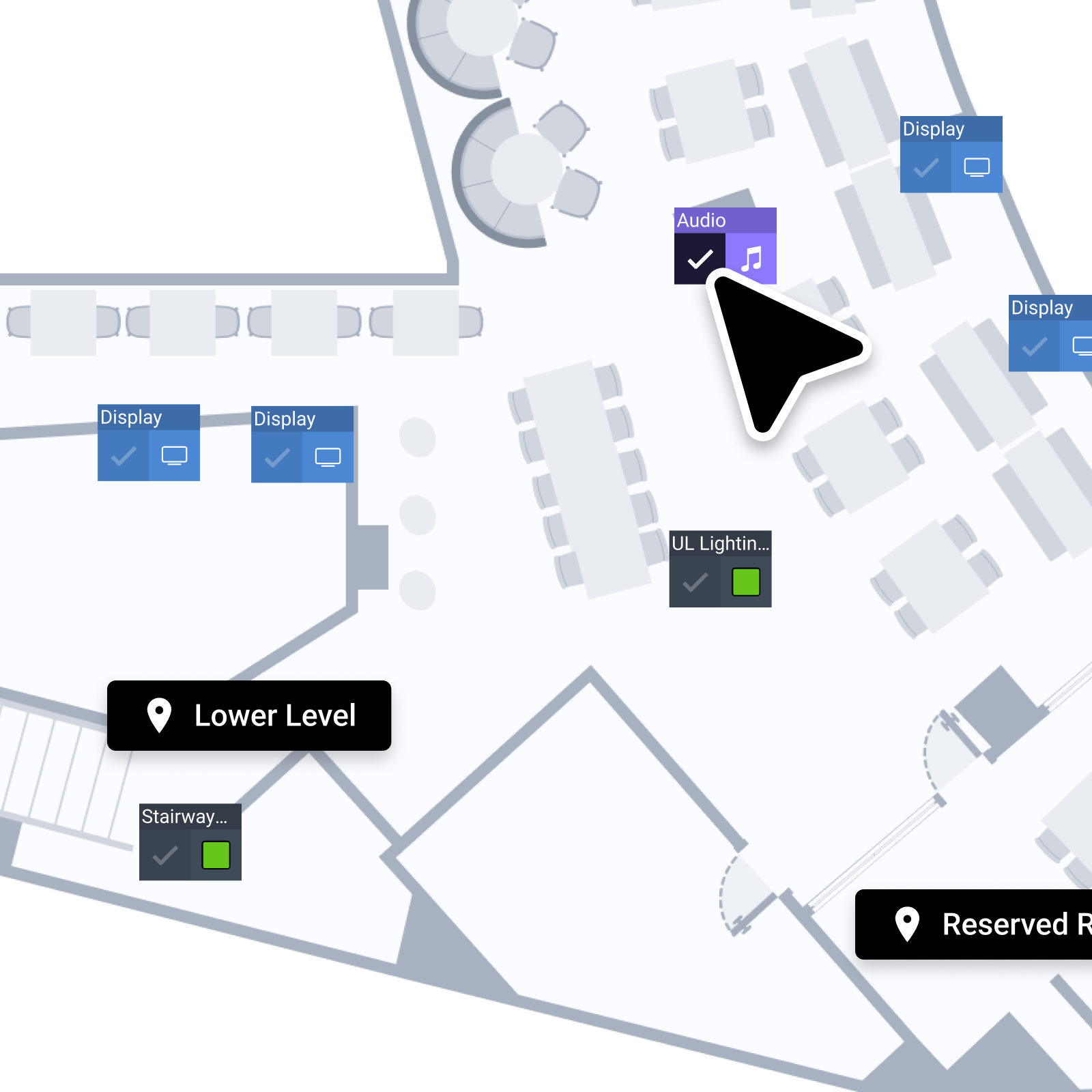Floor plan of a building with various rooms and labeled areas, including an Audio section, multiple display and lighting controls, a staircase, and areas marked as Lower Level and Reserved Room.