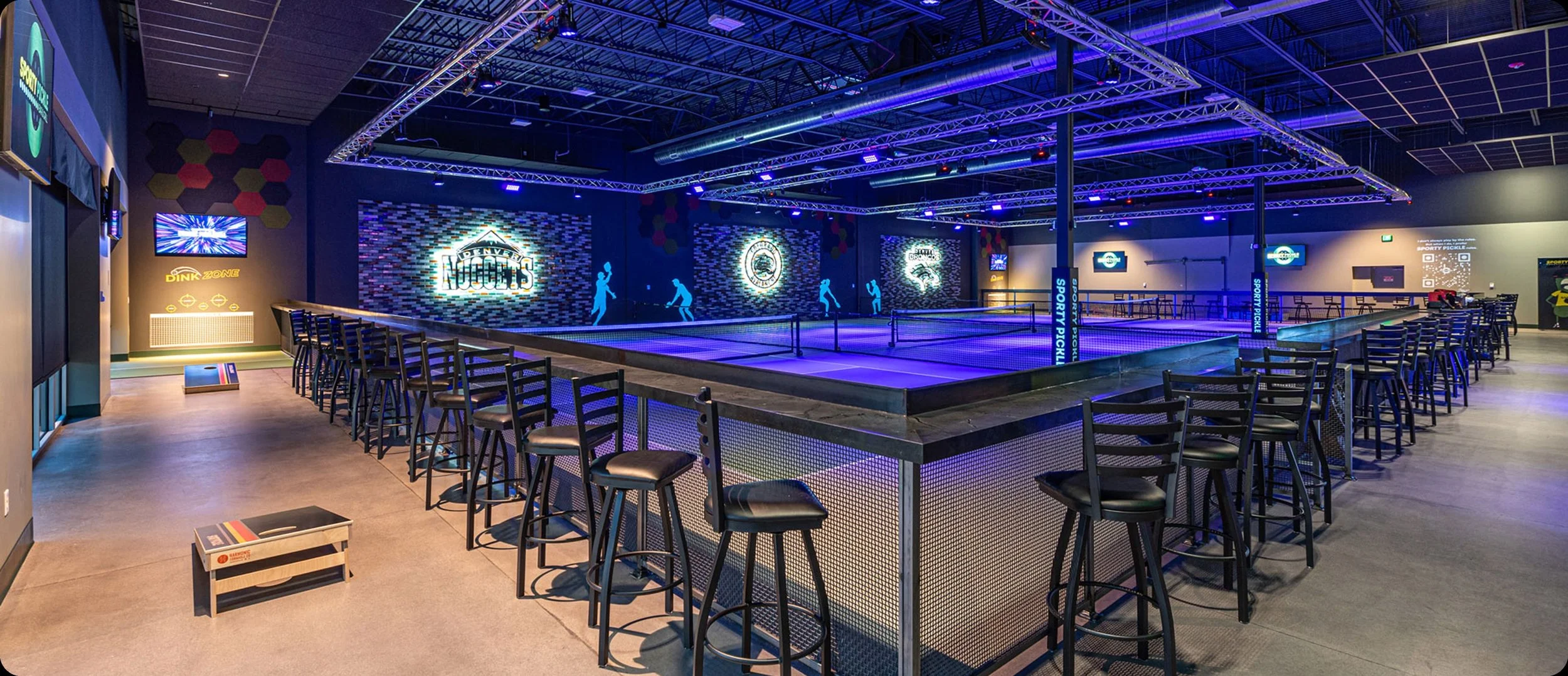 Cosmic pickleball experience with low-voltage lighting and audio powered by SAVI