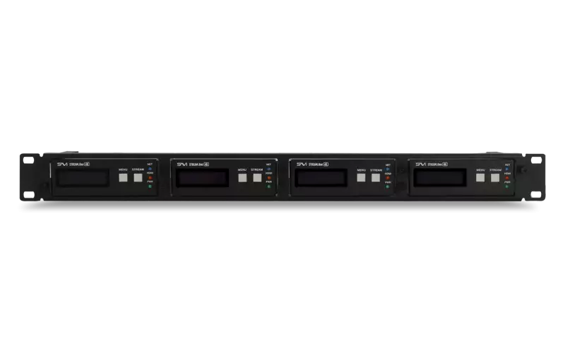 Four black vintage electronic devices with digital screens and buttons, mounted on a black rack.