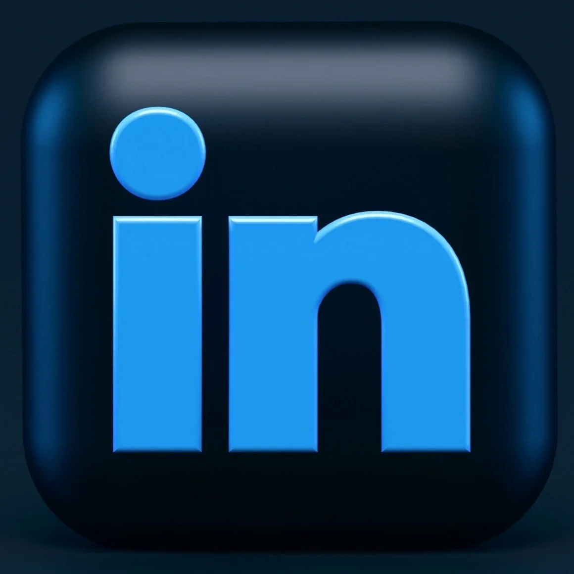 LinkedIn app icon with a black background and blue lowercase 'in' with a blue dot above the 'i'.