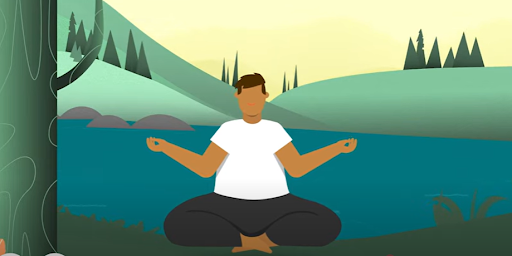 A person meditating in a seated cross-legged position near a lake with green hills and trees in the background.