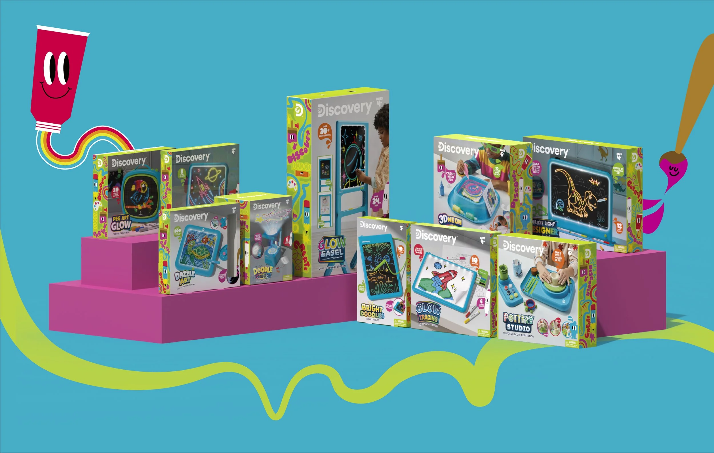 Display of children’s art kits on pink shelves with a playful turquoise background featuring a smiling red paint tube with a rainbow trail and green squiggly lines.
