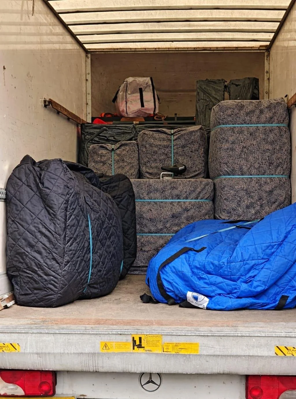 Carefully wrapped and secured sofas and furniture using high-quality sofa covers, protective blankets, ensuring safe transport during a 2-bed flat move to Guilford with our experienced team