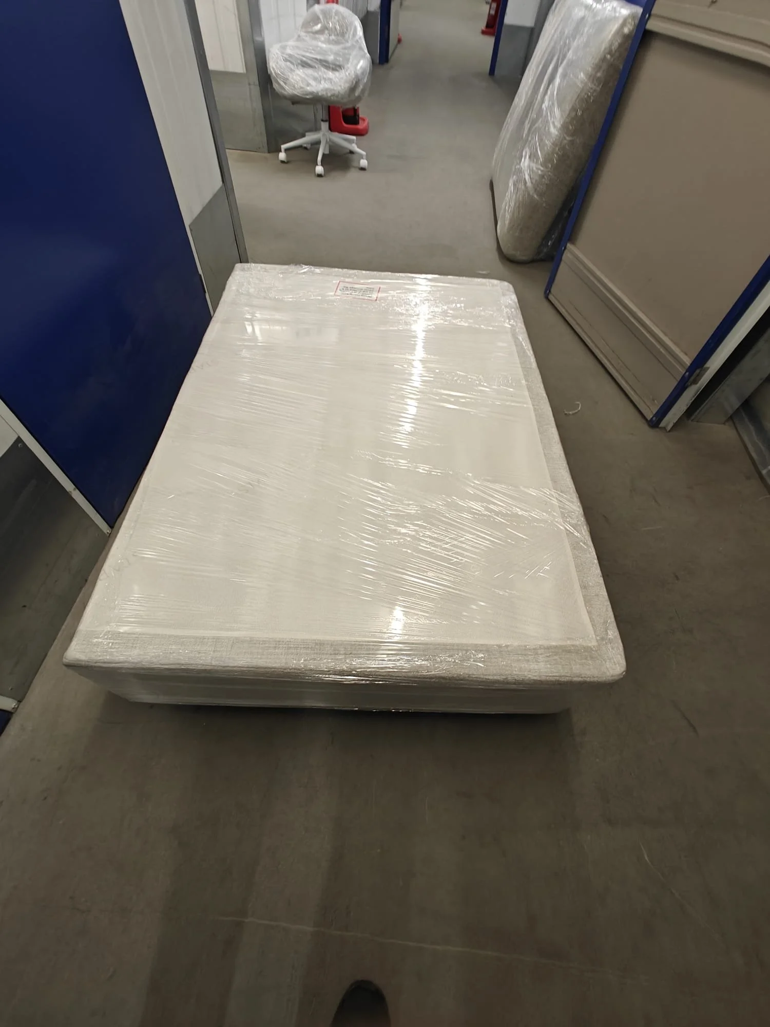 saran-wrapped-bed-base-storage-home-move.jpeg