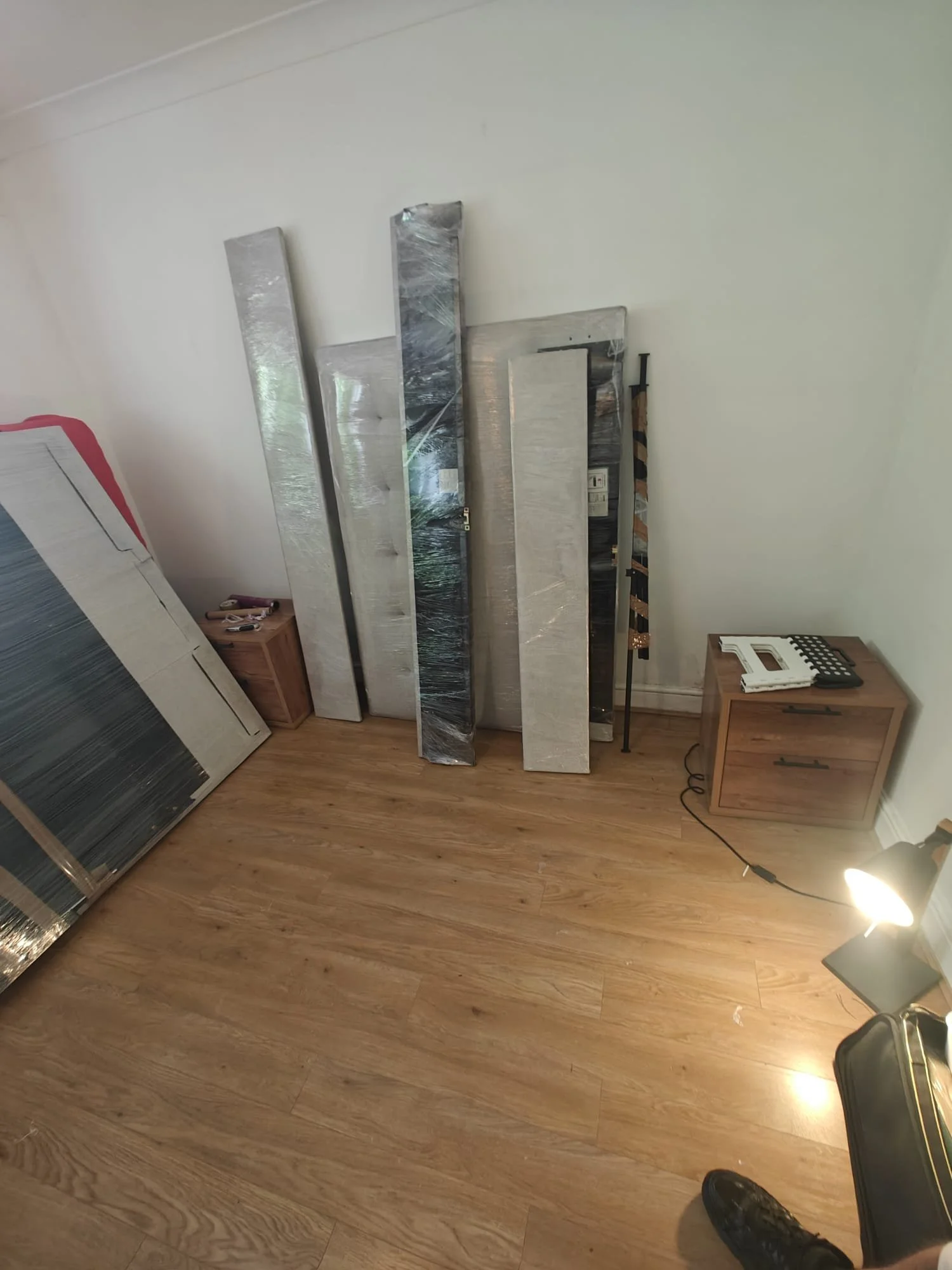 Ottoman bed taken apart by Ready to go house movers and removals and wrapped in stretch wrap ready for moving into new home