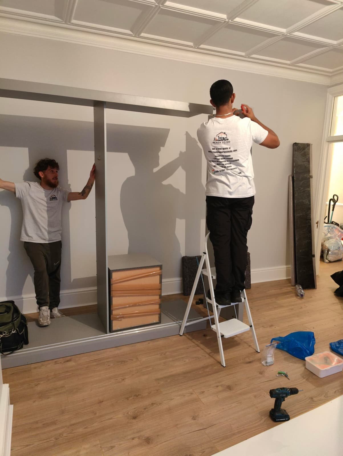 2-men-reassembling-wardrobe.jpeg