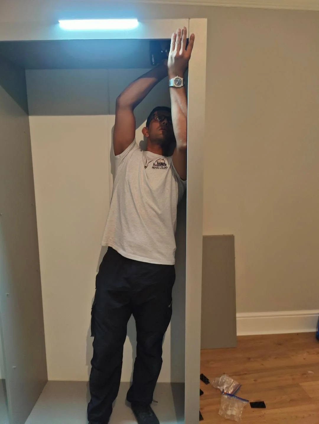 Wardrobe being reassembled by Ready to go house movers & removals