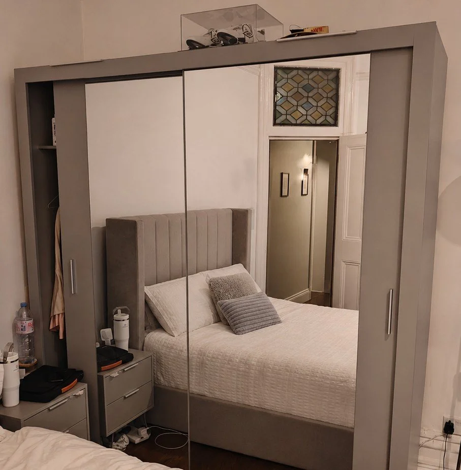 Wardrobe about to be taken apart by ready to go house movers and removals to be transported from West Hampstead to Hampstead Heath for a house moving job in London