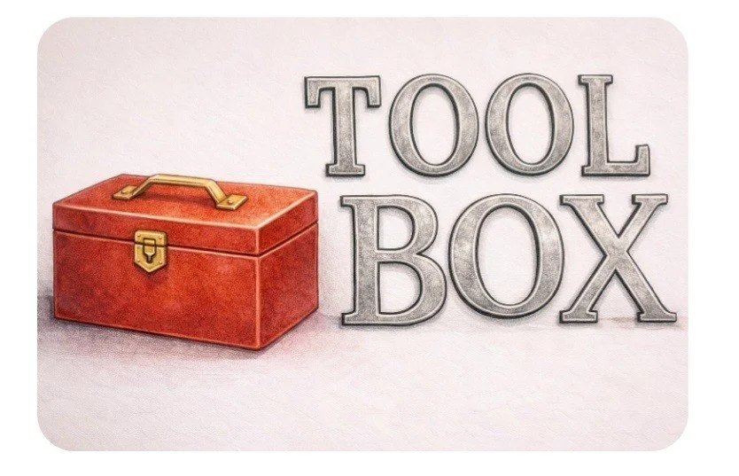 A red toolbox with a handle and latch, next to the words "TOOL BOX" in large gray letters.