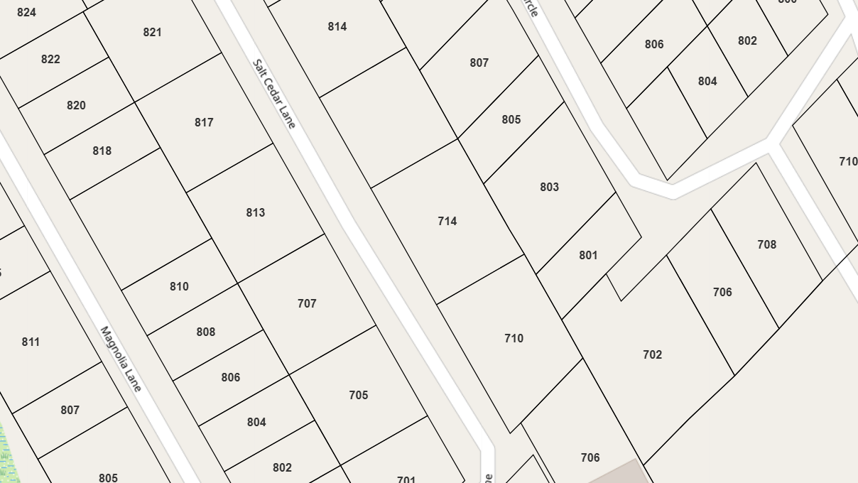A map showing a residential area with numbered lot parcels, streets labeled "Magnolia Lane," "Salt Cedar Lane," and other smaller roads, with lot numbers ranging from 701 to 824.