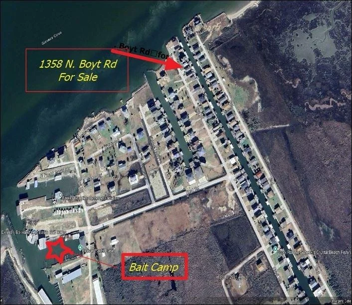 Satellite map showing a residential area near water with marked locations including a property at 1358 N. Boyt Rd for sale and a bait camp.