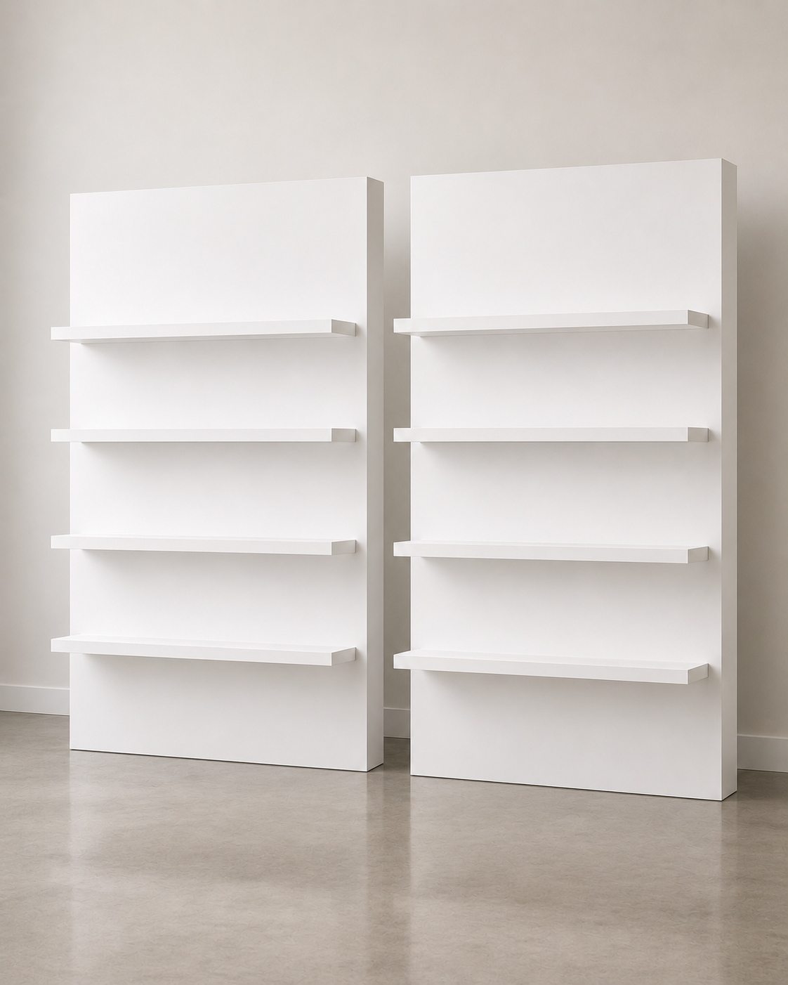 Two white freestanding display shelf units with four shelves each, styled side by side against a neutral beige backdrop.