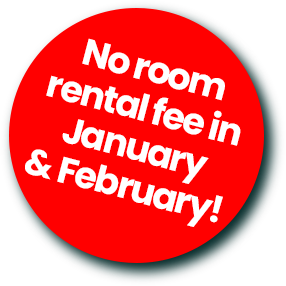 Red circular sticker with white text stating no room rental fee in January & February.