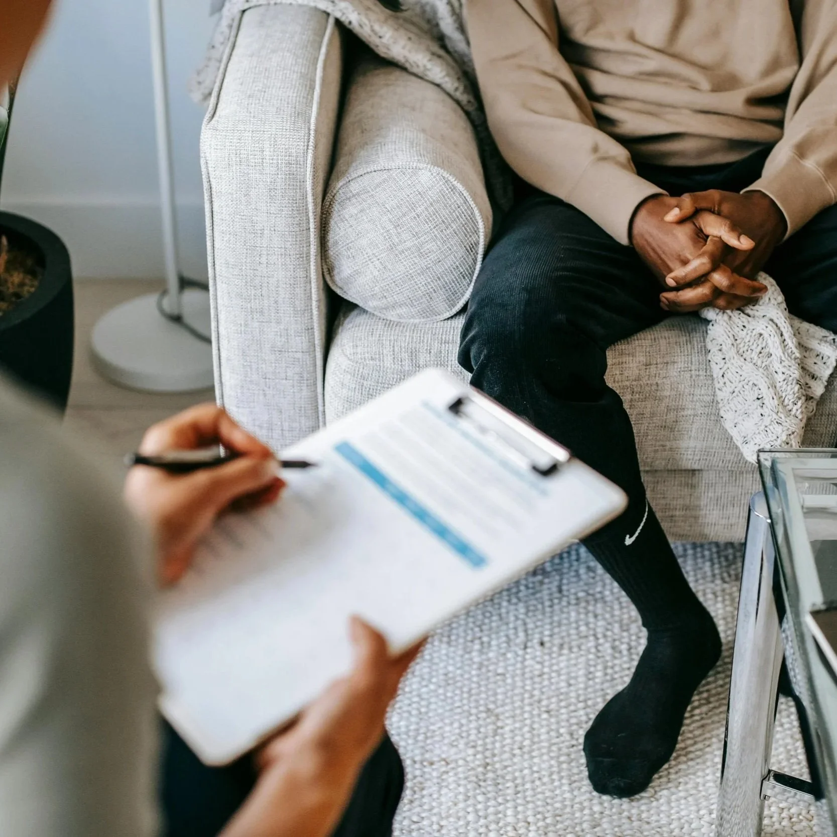 A stock photo of a person having an in-person consultation