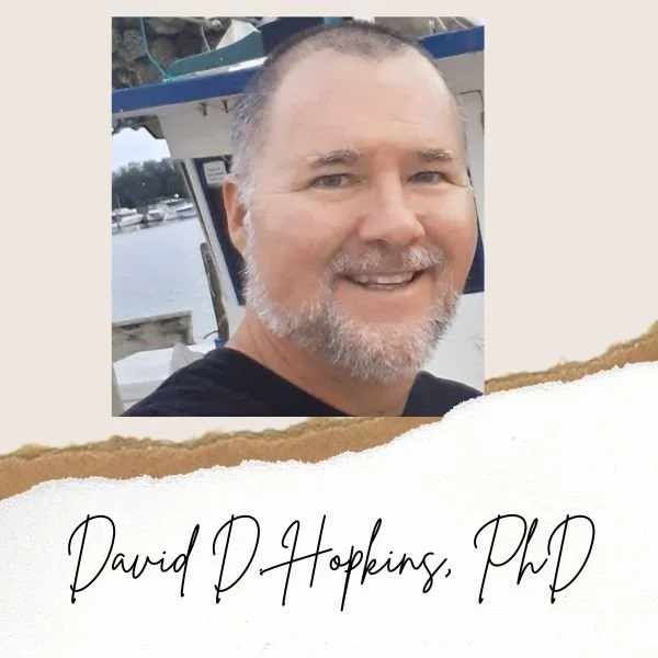Picture of Dr. David D. Hopkins by a boat
