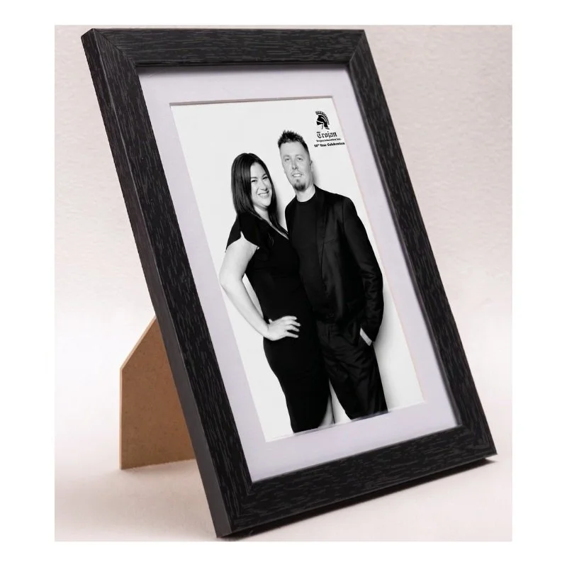 Framed portraits from a corporate milestone event
