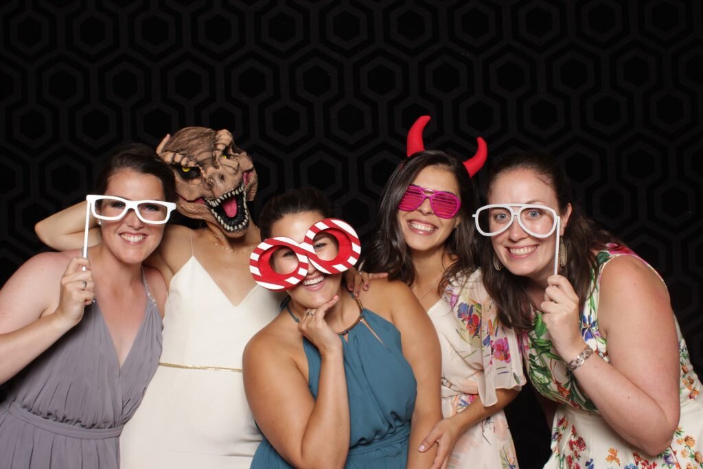 Wedding guests pose for a photo in a Calgary wedding photo booth