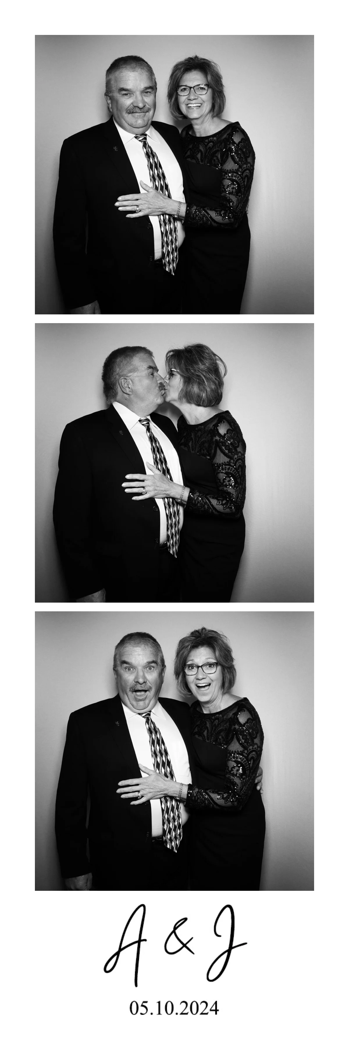 Three black and white photo booth pictures of a middle-aged man and woman, dressed in formal attire. In the first, they stand close, smiling at the camera; in the second, they kiss; in the third, they look surprised with wide eyes and open mouths. Th