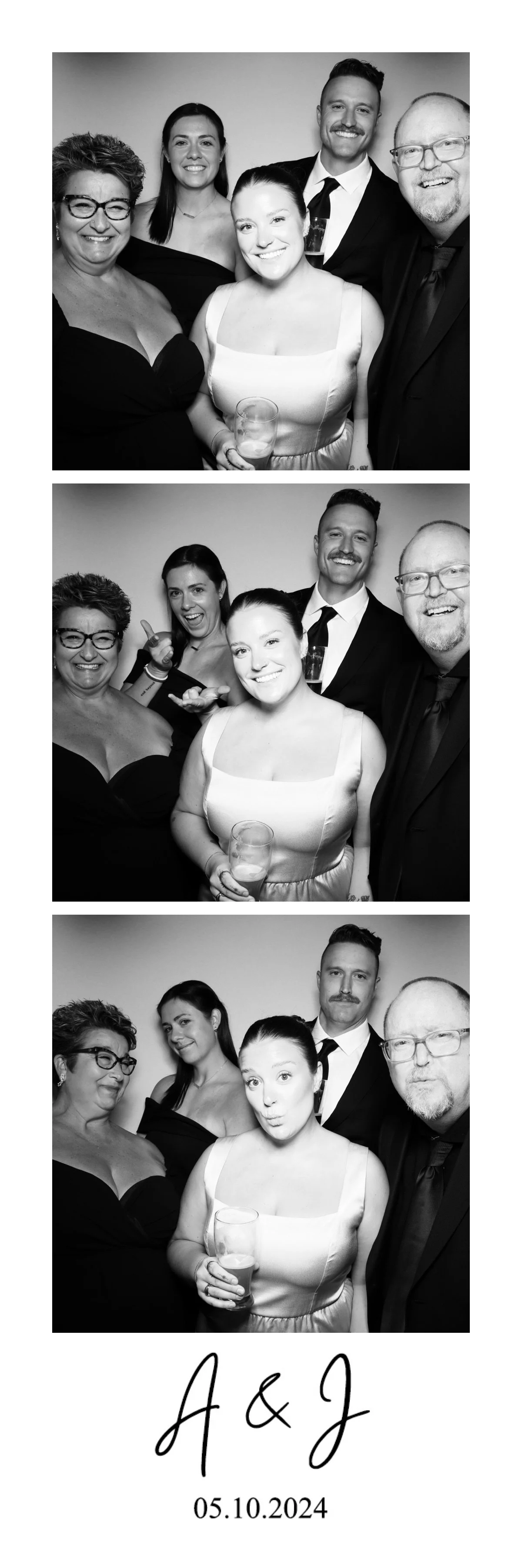 A black and white photo booth strip with three pictures of five people at a celebration event. They are dressed in formal attire, smiling, making playful gestures, and holding drinks. The strip includes a signature "A & J" and the date "05.10.2024."