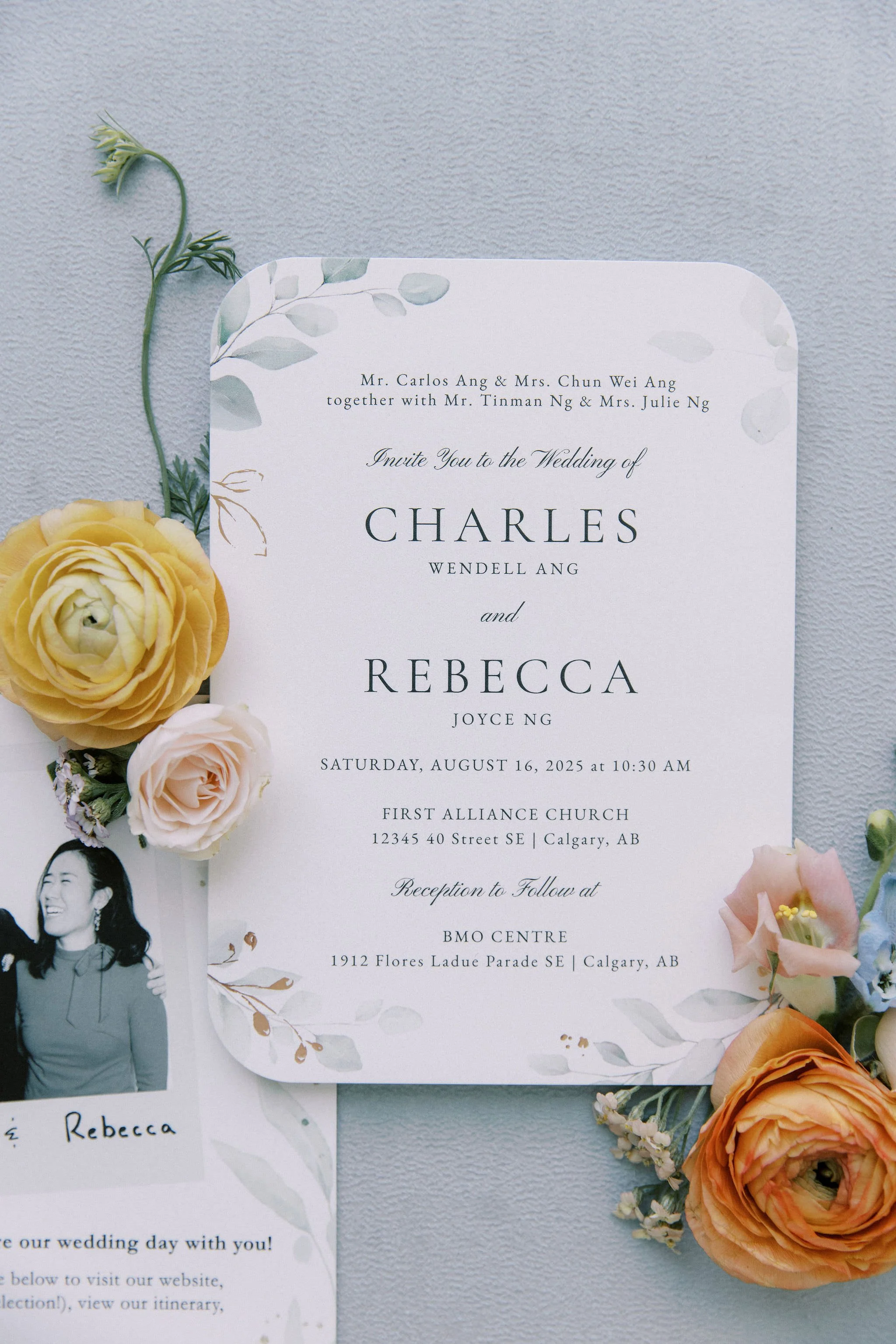 Wedding invitation card with flowers and a black-and-white photo of a woman.