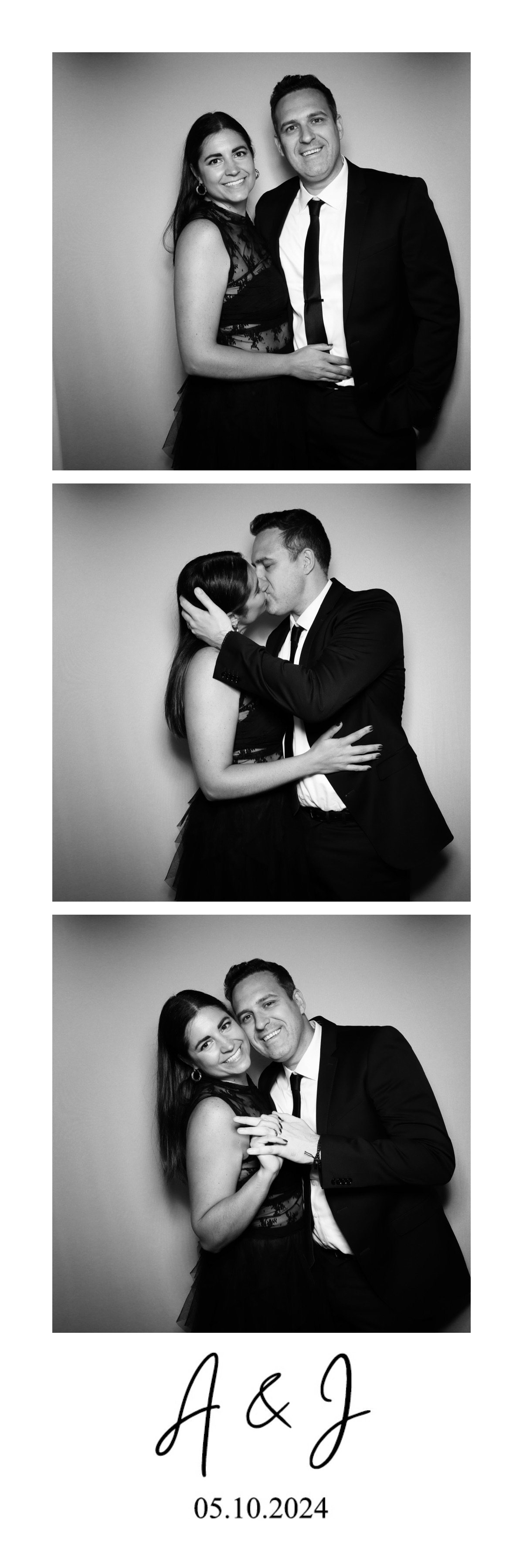 Black and white photo booth strip featuring a couple in formal attire. In the top image, they are standing close together, smiling at the camera. In the middle, they are kissing, and in the bottom, they are smiling and holding hands. The strip is lab