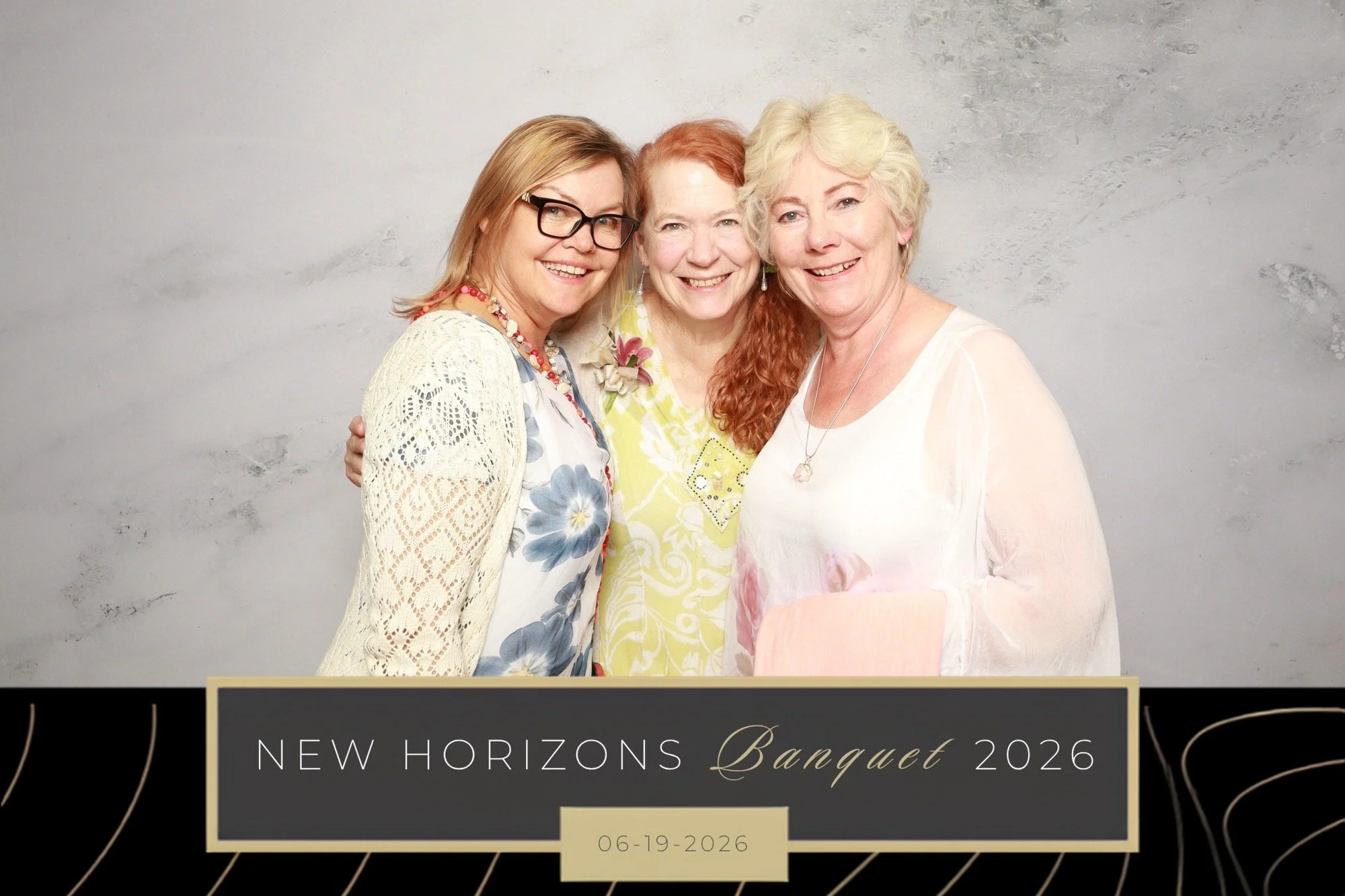 Gala attendees pose for photos in a print photo booth at a Gala in Calgary