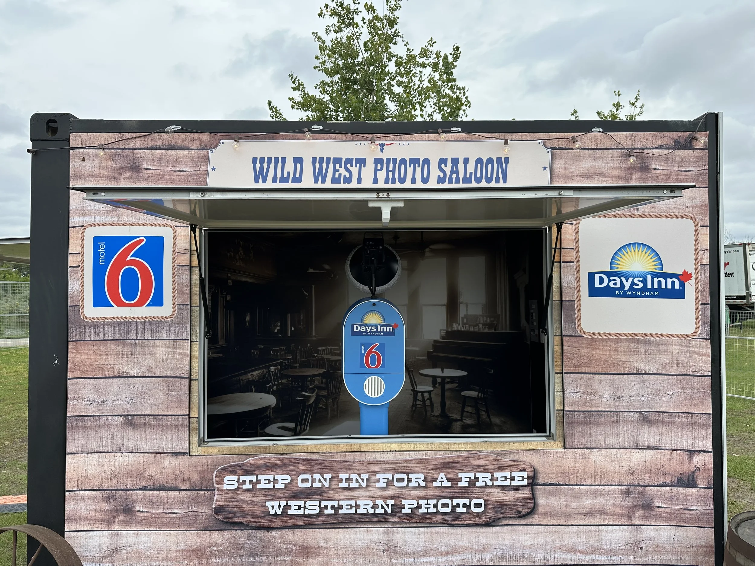Mobile Saloon style installation at Country Thunder with a vinyl wrapped photo booth