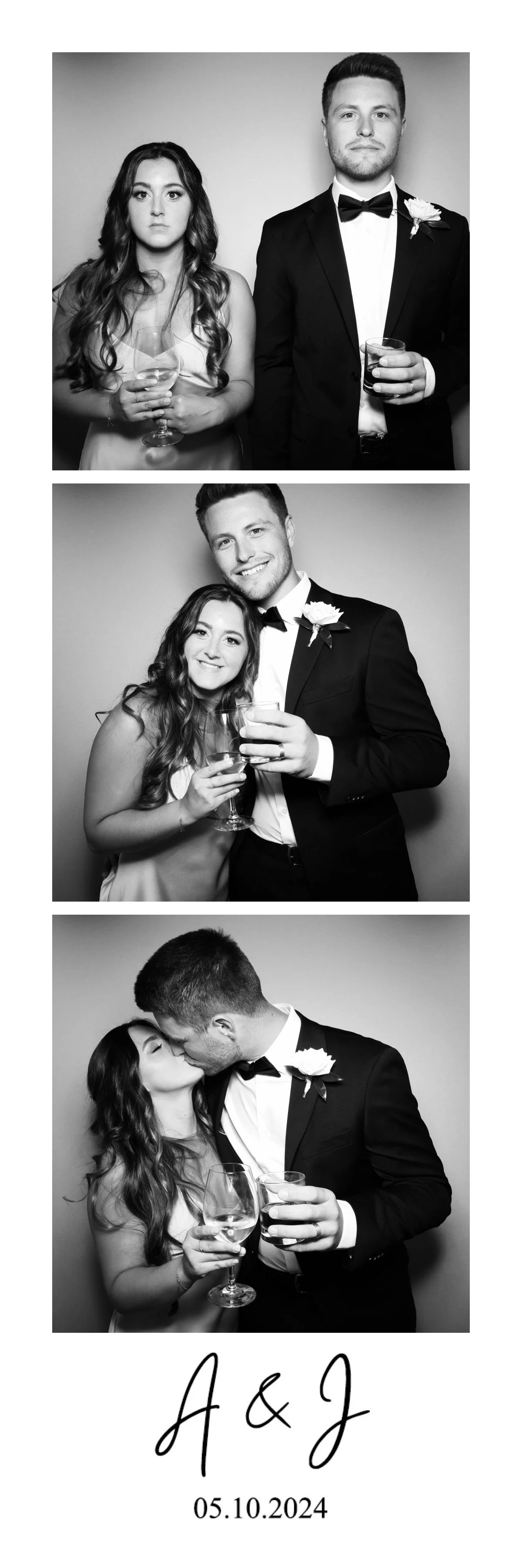 A black and white photo booth strip featuring three images of a couple at their wedding. The couple is dressed in formal attire, with the woman in a dress and the man in a tuxedo with a boutonnière. In the first photo, they are standing side by side,