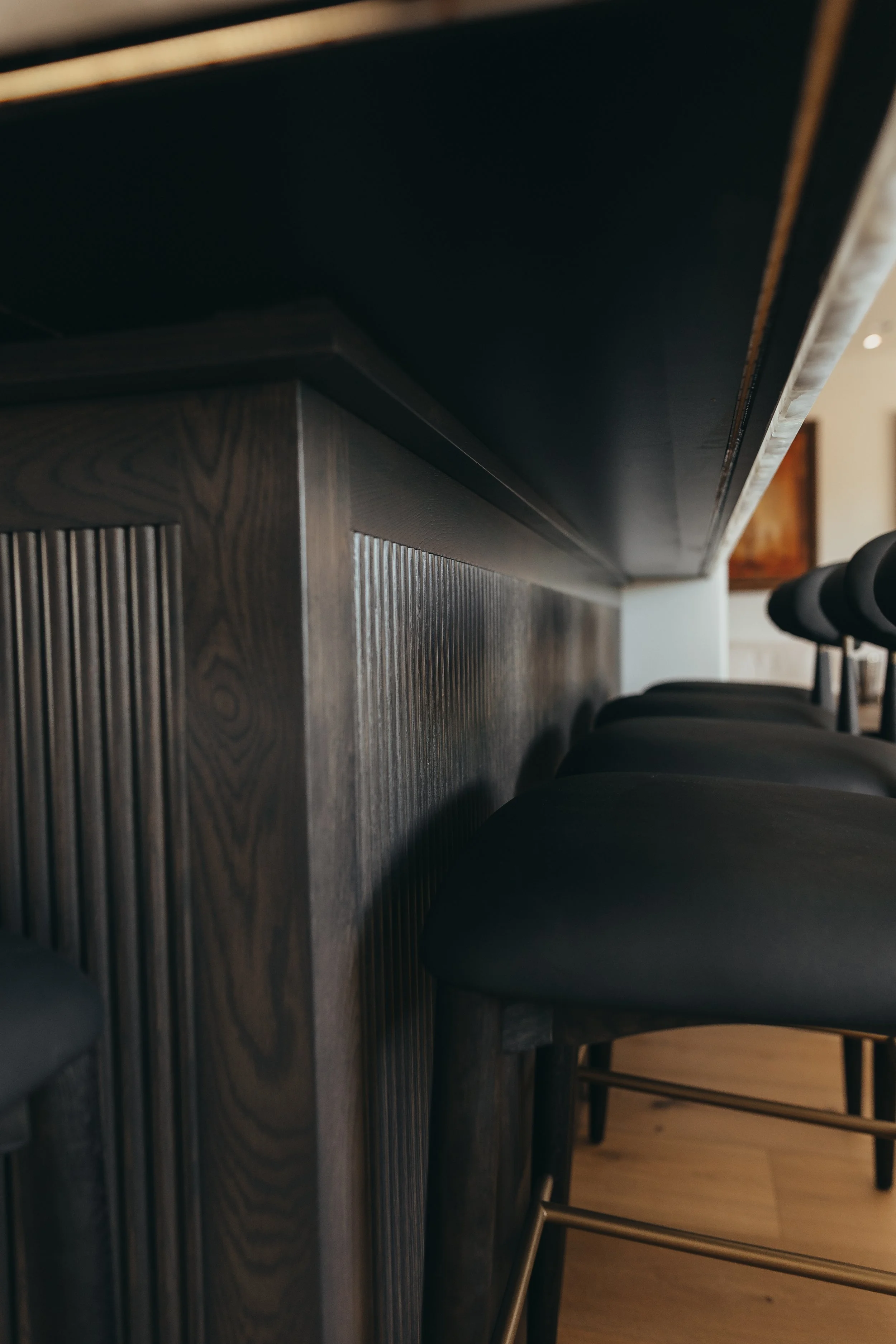 Fluted panel back of bar cabinetry