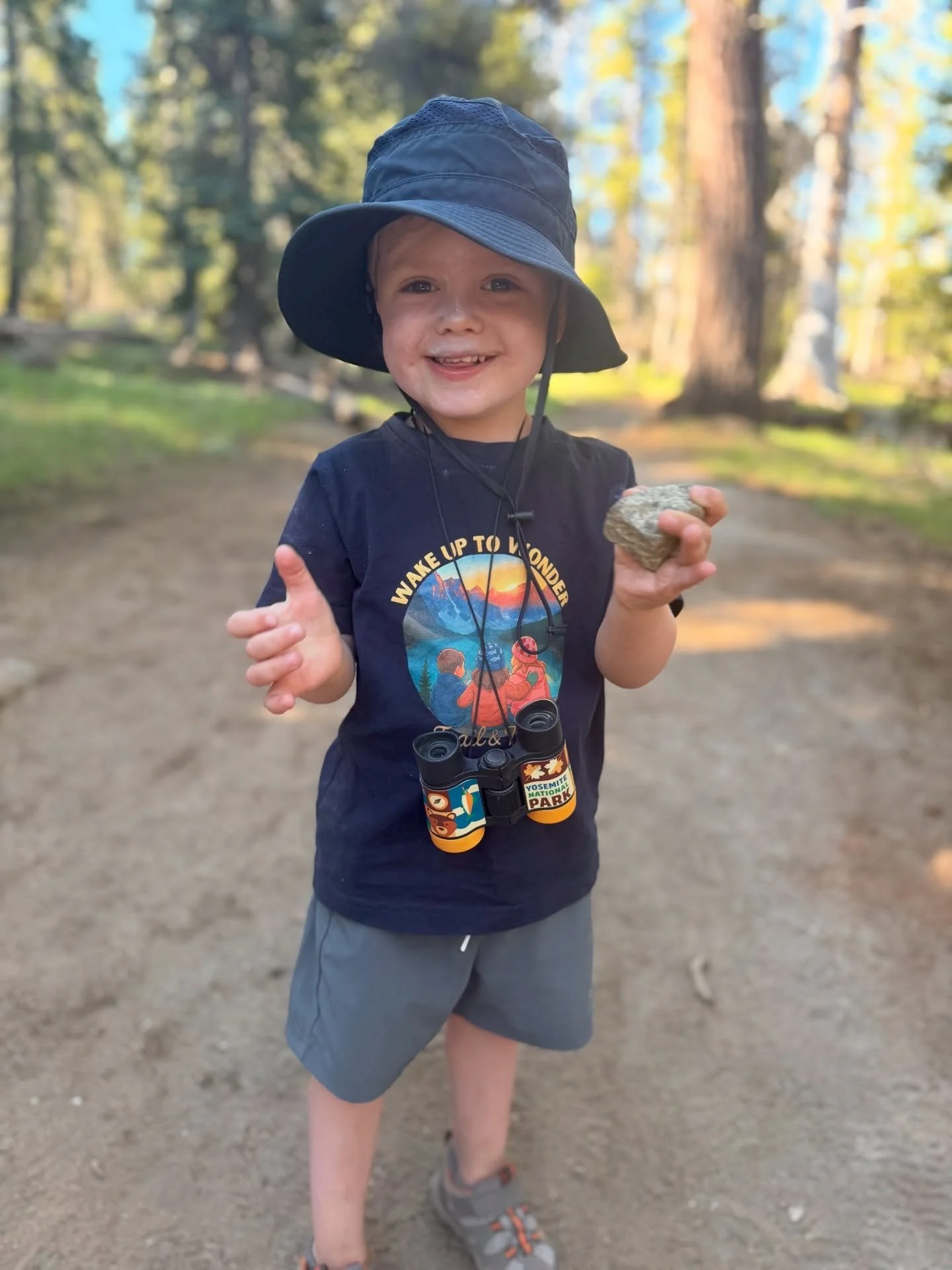 🌄 Wake up to wonder. 

This tee was inspired by one unforgettable morning at Moraine Lake - bundled up before dawn, little arms around each other, watching the world light up in blues, pinks, oranges, and yellows.
At Trail &amp; Tide, every design t
