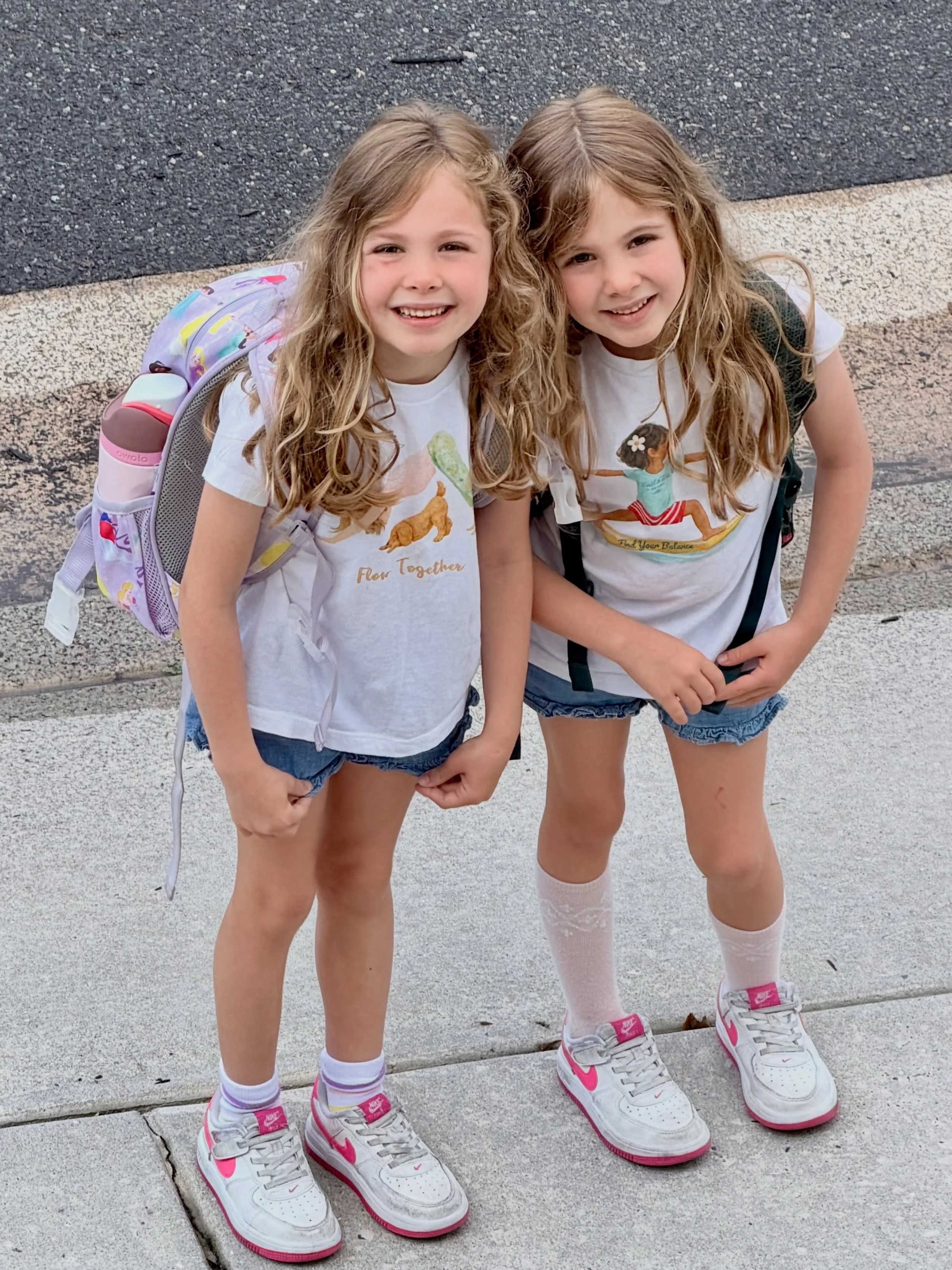 From savasana to school drop-off 🧘🏼&zwj;♀️📚✨

Matching yoga tees, beach wave hair, tiny backpacks, and twin summer adventures ahead. 🤍

#TrailAndTide #LittleExplorers #TwinStyle #AdventureKindly #yogakids