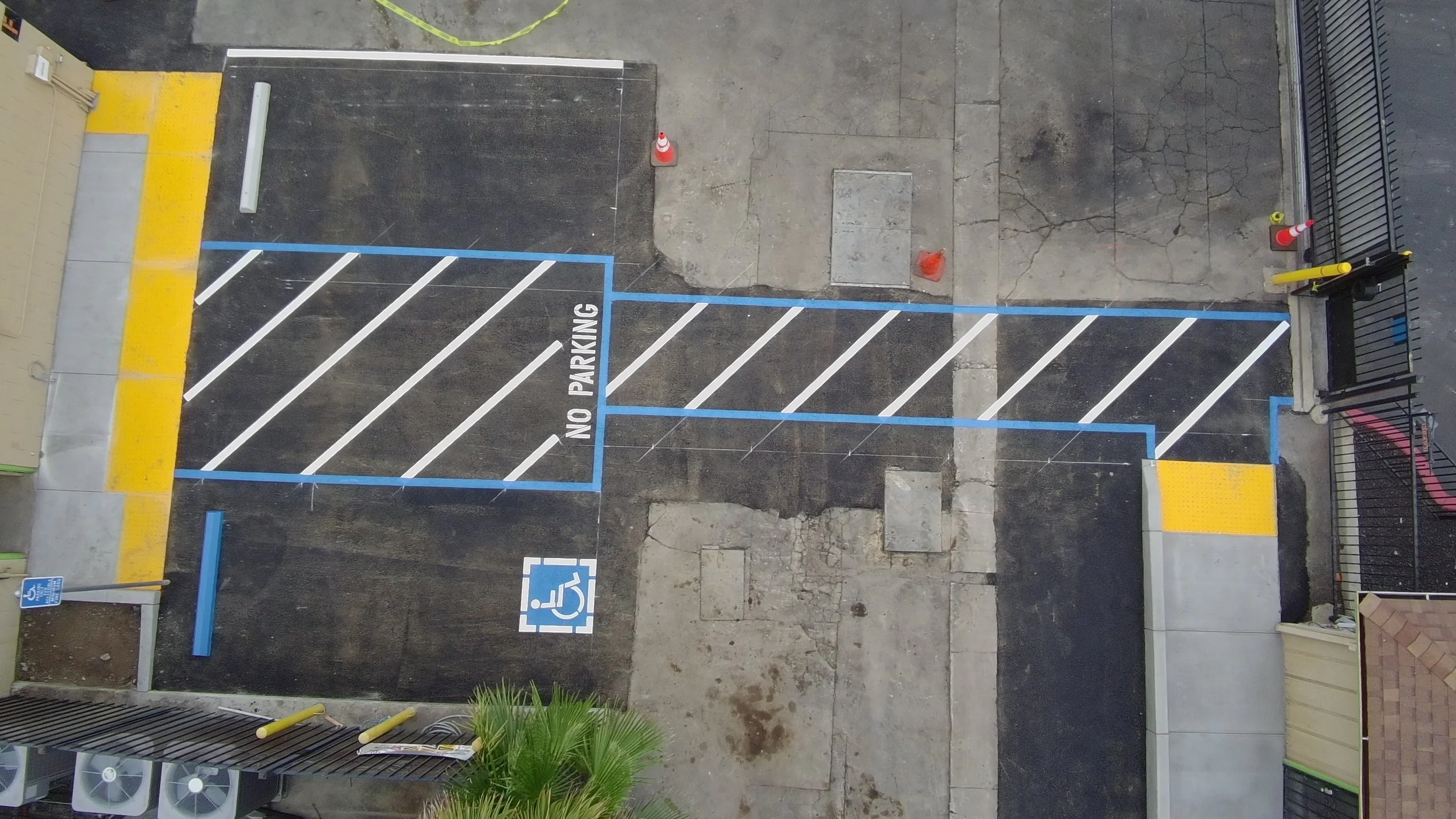 After — aerial view completed commercial parking lot ADA striping and accessible pathway Bay Area — Precision Concrete Engineering Inc.