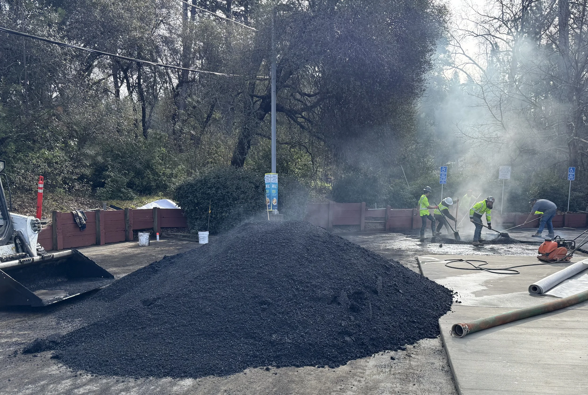 Professional asphalt paving crew spreading hot mix Bay Area — Precision Concrete Engineering Inc.