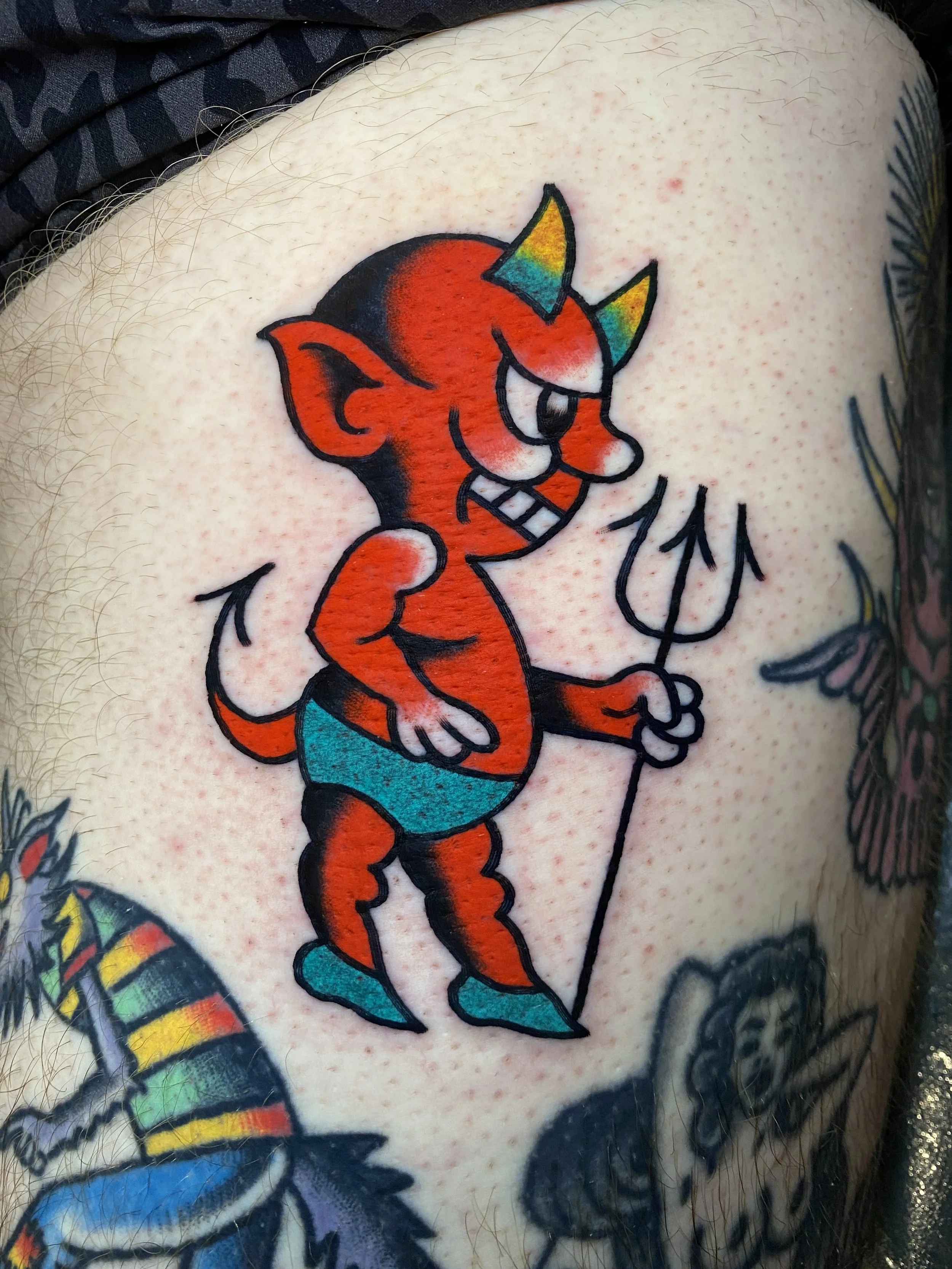 Little devil tattoo made by Sonny Roth, Portland Maine