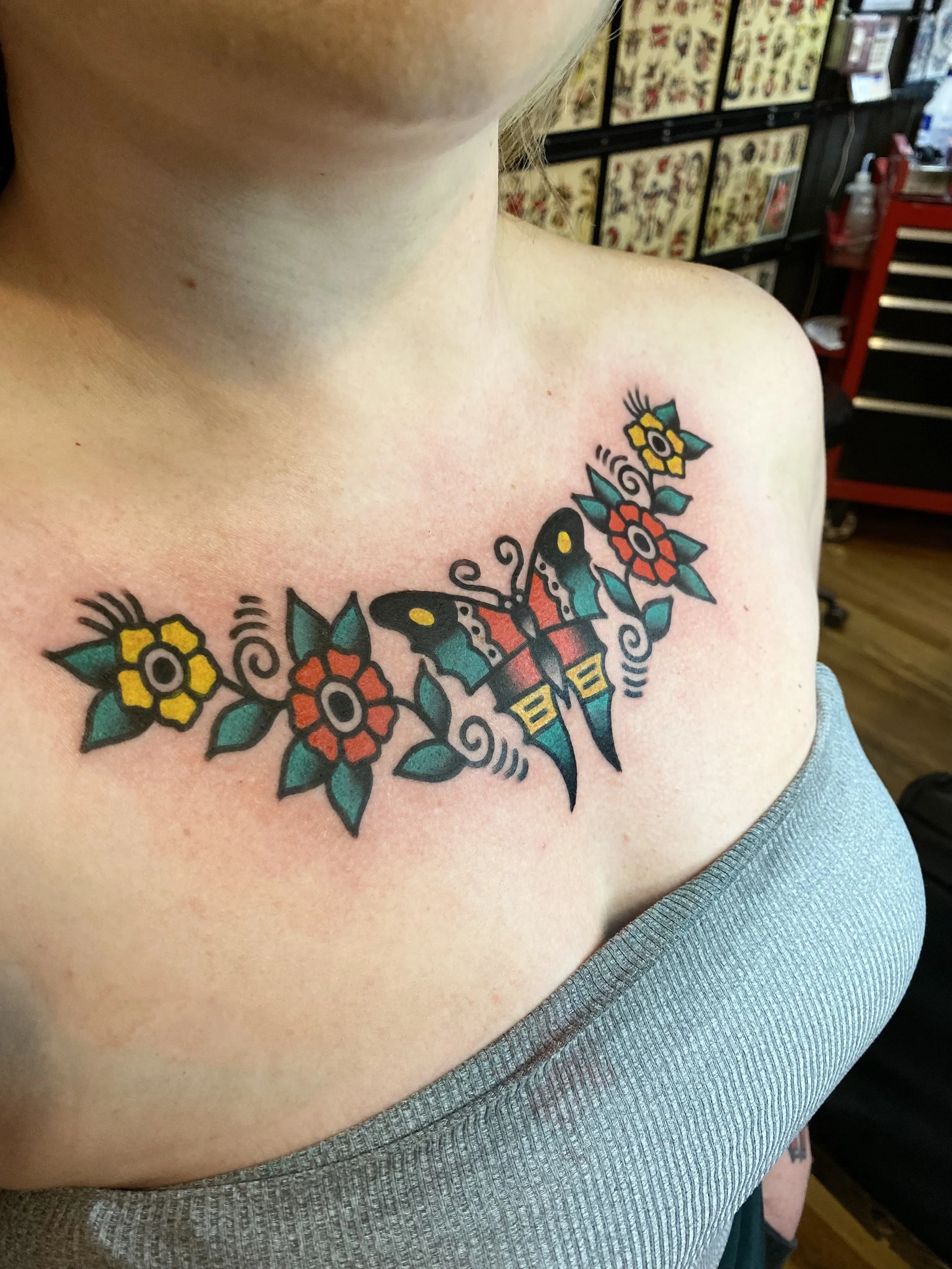 butterfly and flowers chest tattoo design