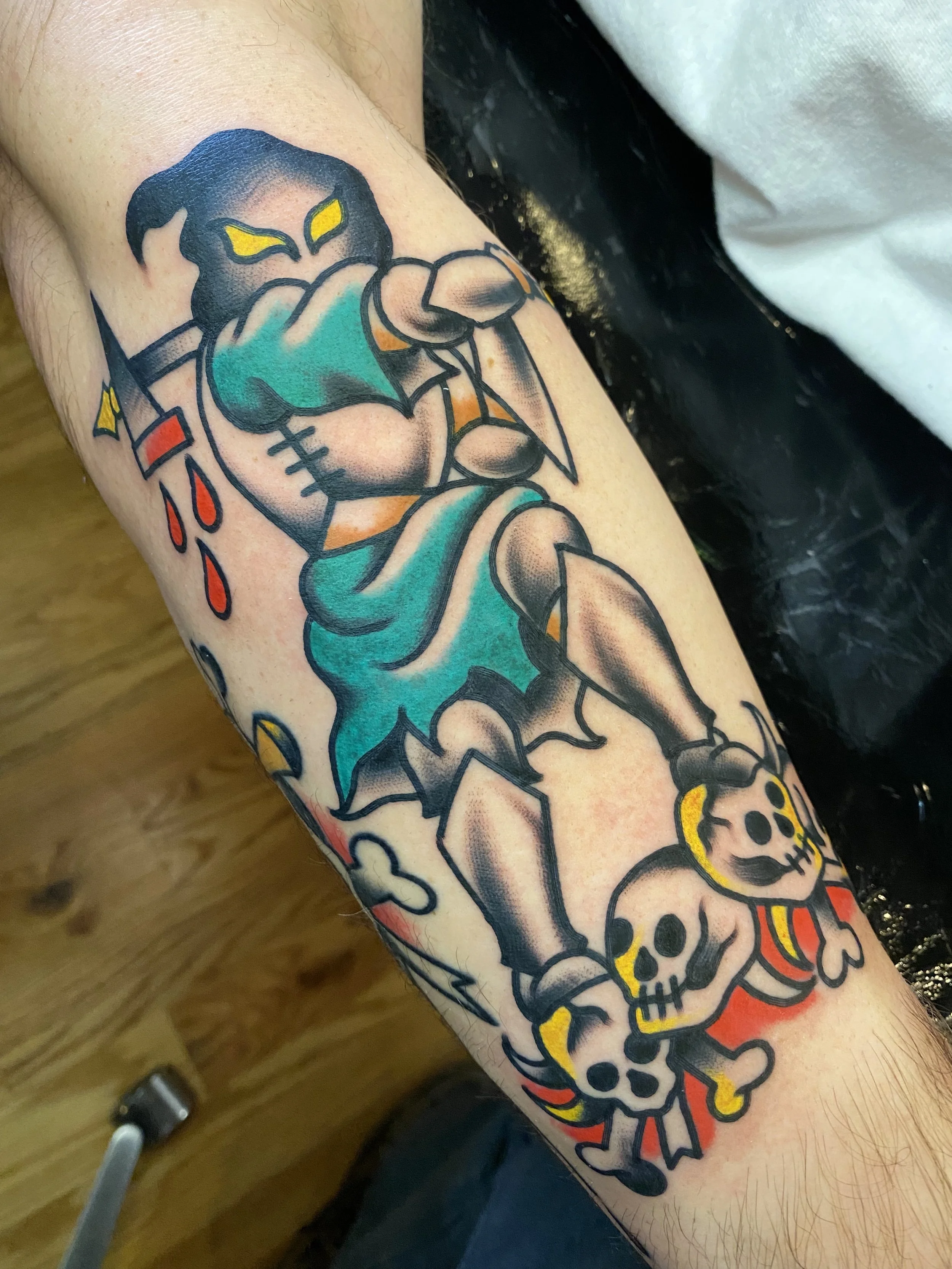 Executioner tattoo with skulls