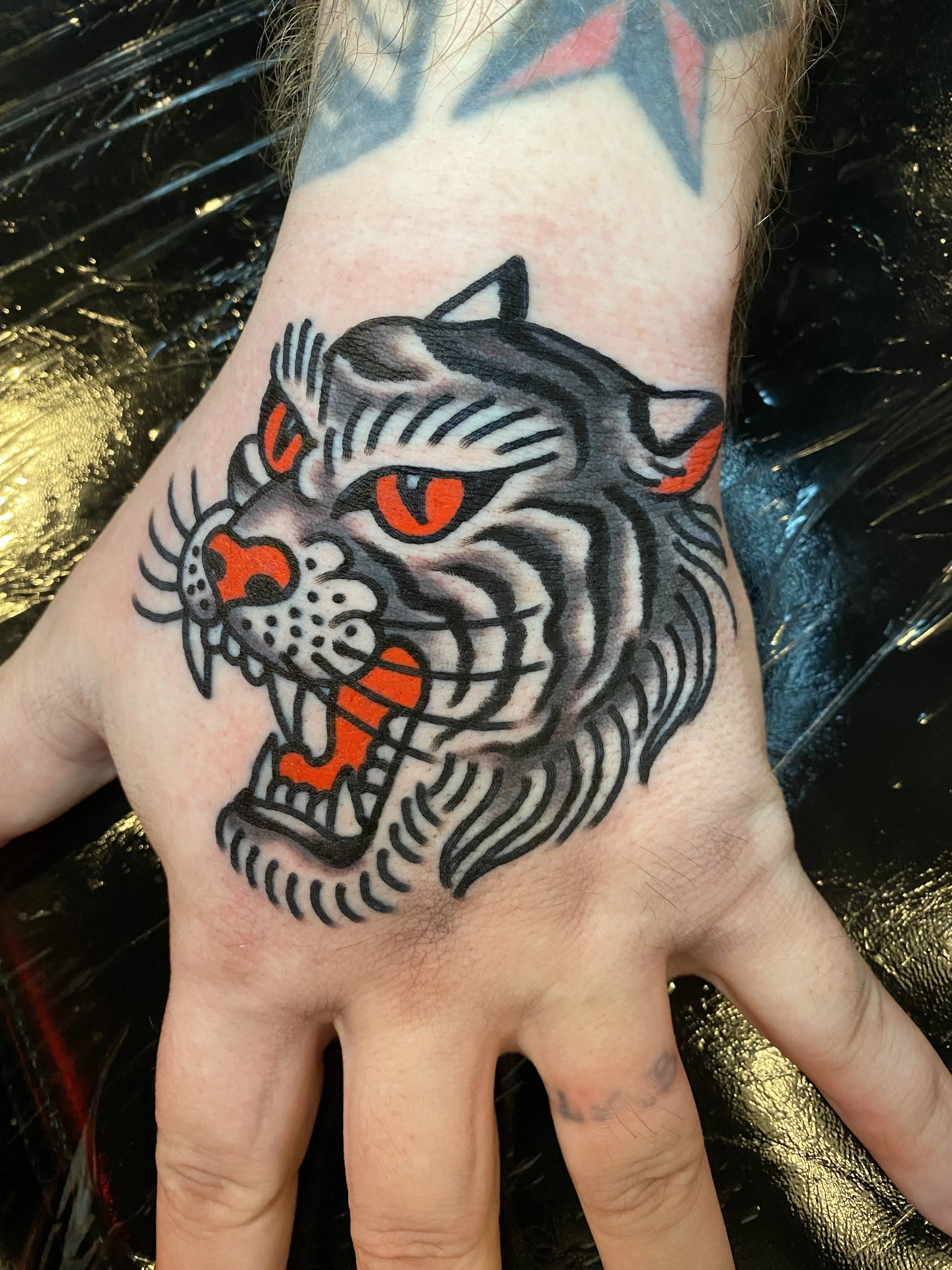 tiger head hand tattoo