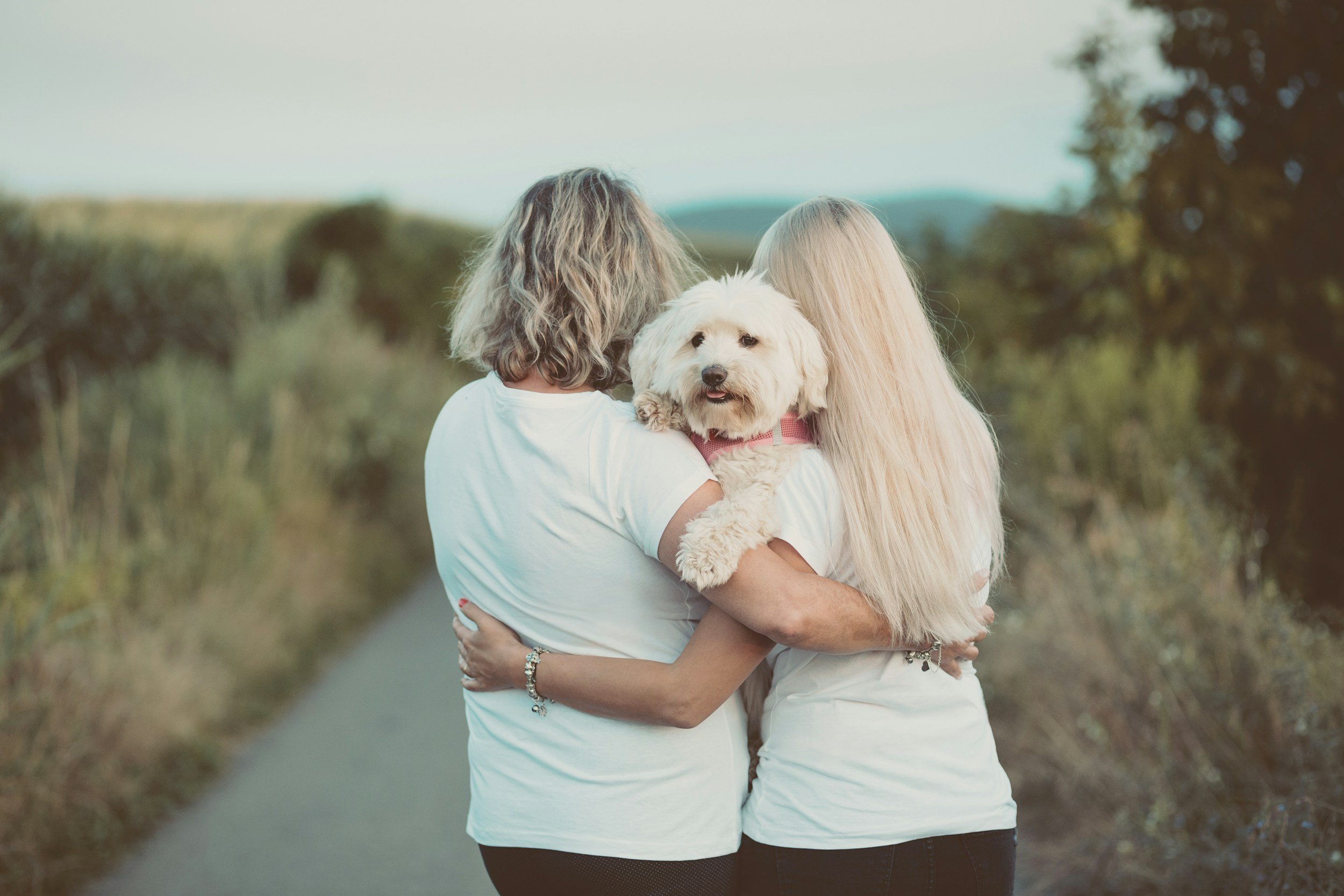 mother and daughter standing together