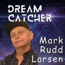 Poster featuring a man with a black cap and a starry galaxy background. The poster includes the text 'DREAM CATCHER' at the top and 'Mark Rudd Larsen' at the bottom.