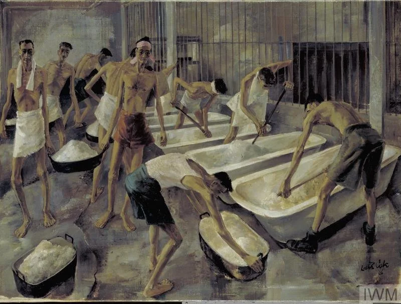 Prisoners in striped uniforms working together to wash large metal tubs in a prison laundry room.