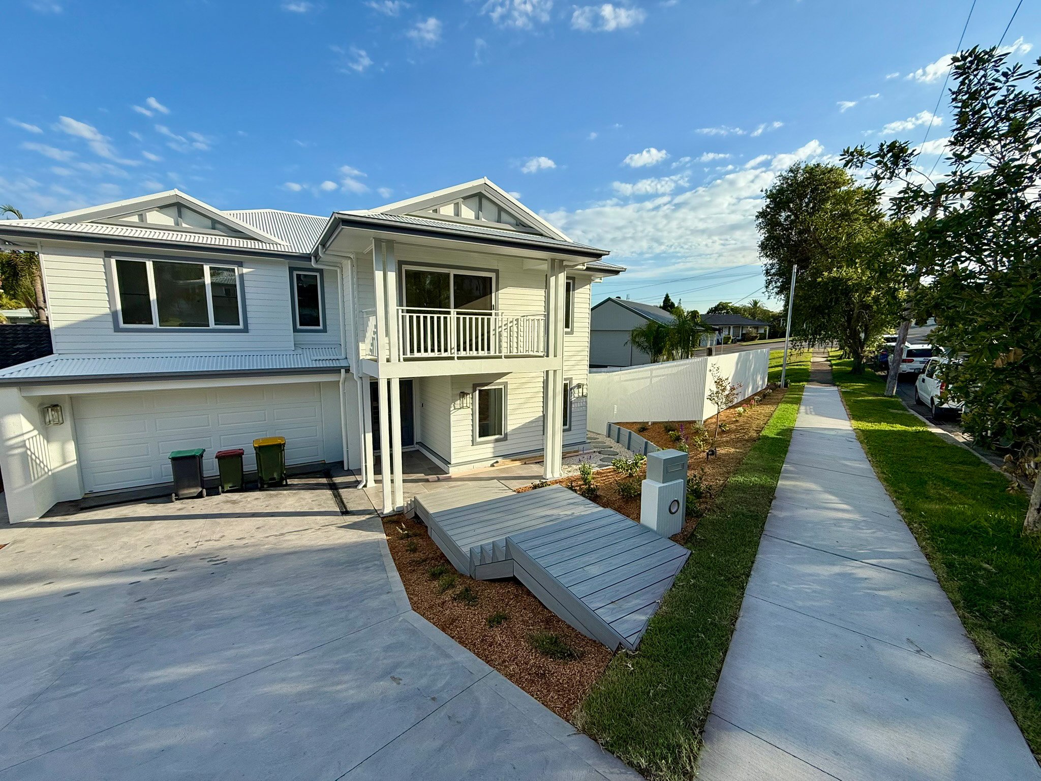 Modern front yard landscaping and timber deck by Total Landscaping in Newcastle NSW