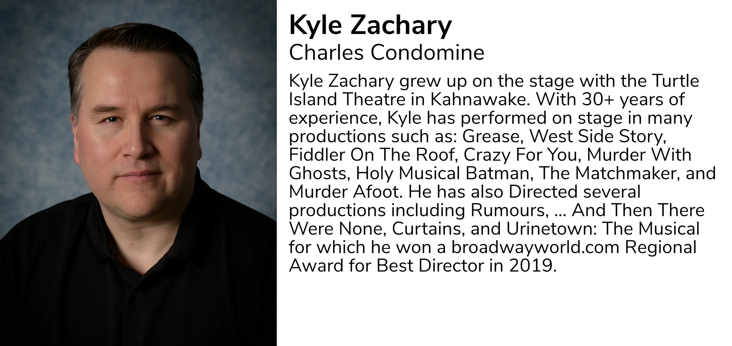 Portrait of Kyle Zachary, a middle-aged man with short, dark hair, wearing a black shirt and standing against a textured blue background.