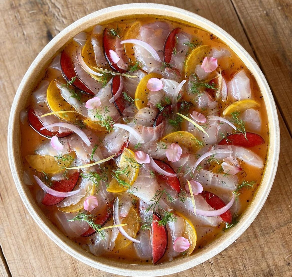 Red snapper crudo, plums, red onions, dill, citrus dressing, black salt