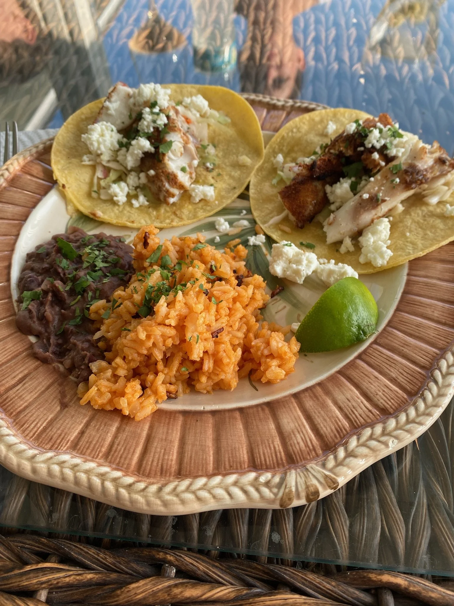 Fresh gulf grouper tacos, homemade refried black beans and arroz rojo