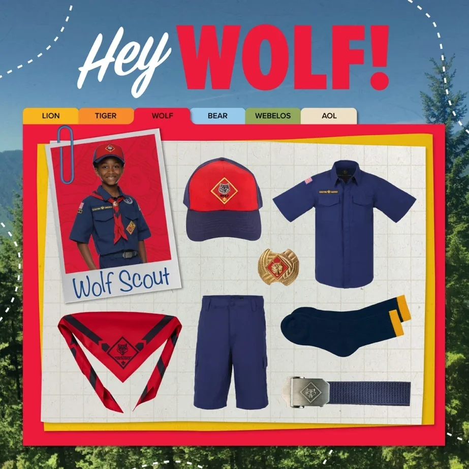 Scout uniform and accessories for Wolf rank, including a hat, blue shirt, shorts, socks, belt, red neckerchief, and a patch, arranged on a grid background.