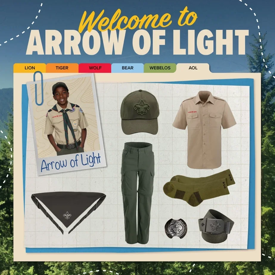 Boy scout uniform items including a cap, short-sleeve shirt, pants, scarf, wristband, and belt with scout insignia, displayed on a board titled 'Welcome to Arrow of Light' with a youth wearing the scout uniform, background of trees and a blue sky.