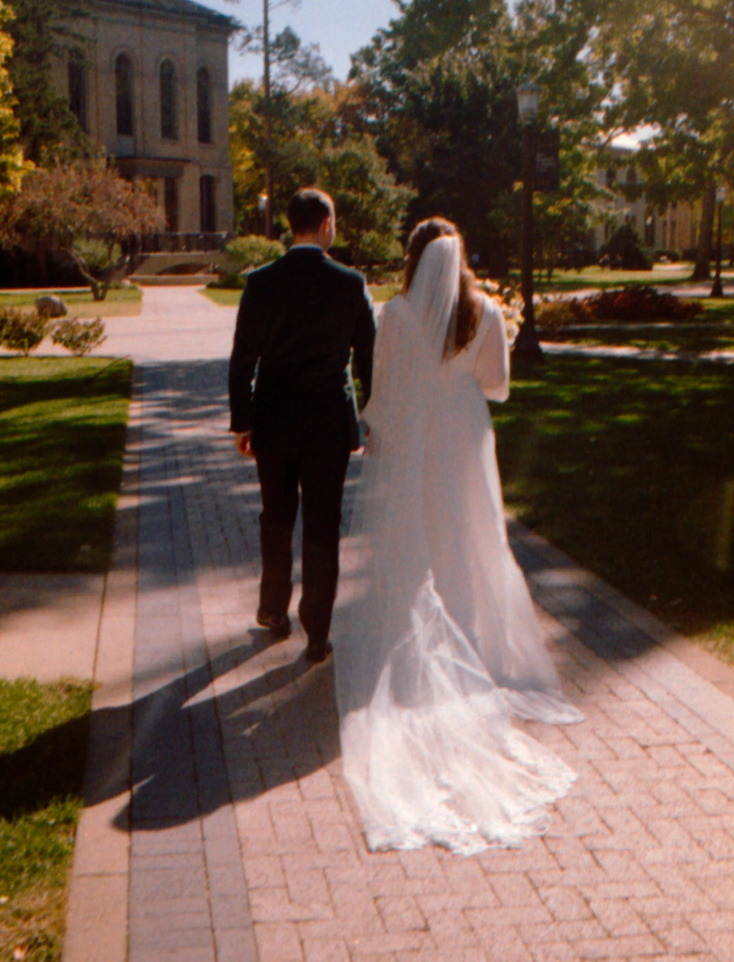 LBW12-wedding-couple-walking-on-notre-dame-campus.jpg
