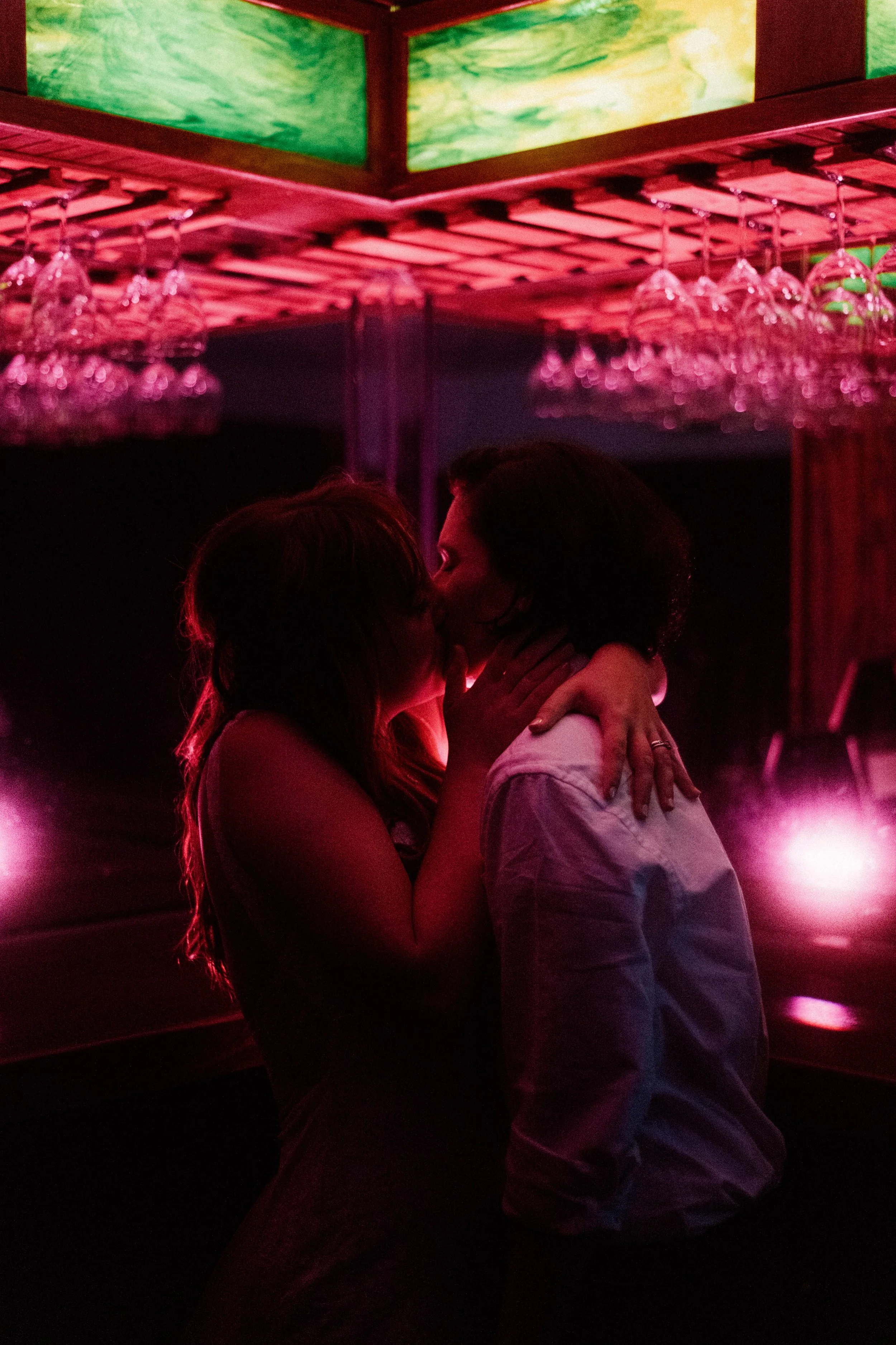 HRD85-lgbtq-women-kissing-in-pink-light.jpg